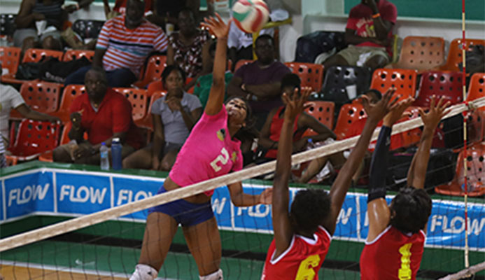 Westside's Malika Davidson,left, executes a kill during her team's match against Glamorgan in the women's finals of the Flow National Volleyball League at the Jean Pierre Complex, Port-of-Spain on Sunday.