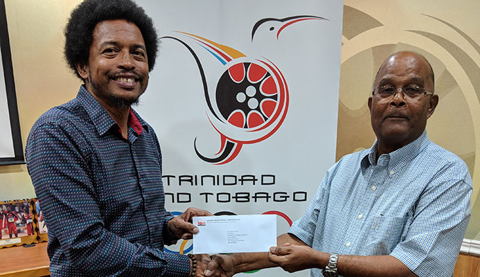 TTOC’s President, Brian Lewis receiving the cheque from Kenneth Ferguson of the KENSON