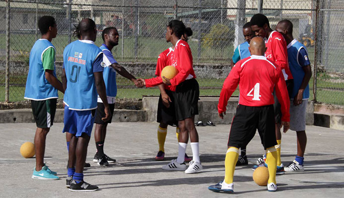 Futsal friendly: Maximum Security Prison (MSP) and Remand Yard inmates exchange greetings before a game of futsal at MSP in Arouca. PHOTOS BY ROGER JACOB