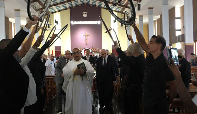 The cycling fraternity gives the late Ian Nivet a final salute at his funeral service yesterday at St Finbar’s RC Church, Morne Coco Road, Diego Martin.