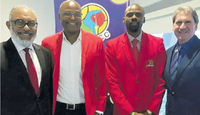 President of COTECC Persio Maldonado of Dominica, left, with tennistt president Hayden Mitchell, 2nd from left, his secretary Jermille Danclar, 2nd from right, and David Haggerty, president of the ITF.