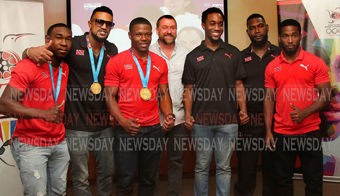 TT cyclists and staff at the TT Olympic House in Port of Spain, on Wednesday, after returning from the 2019 Pan American Games in Lima, Peru. Keron Bramble, from left, Njisane Phillip, Nicholas Paul, technical director Erin Hartwell, Jabari Whiteman, mechanic Elijah Greene and Kwesi Browne. PHOTO BY SUREASH CHOLAI