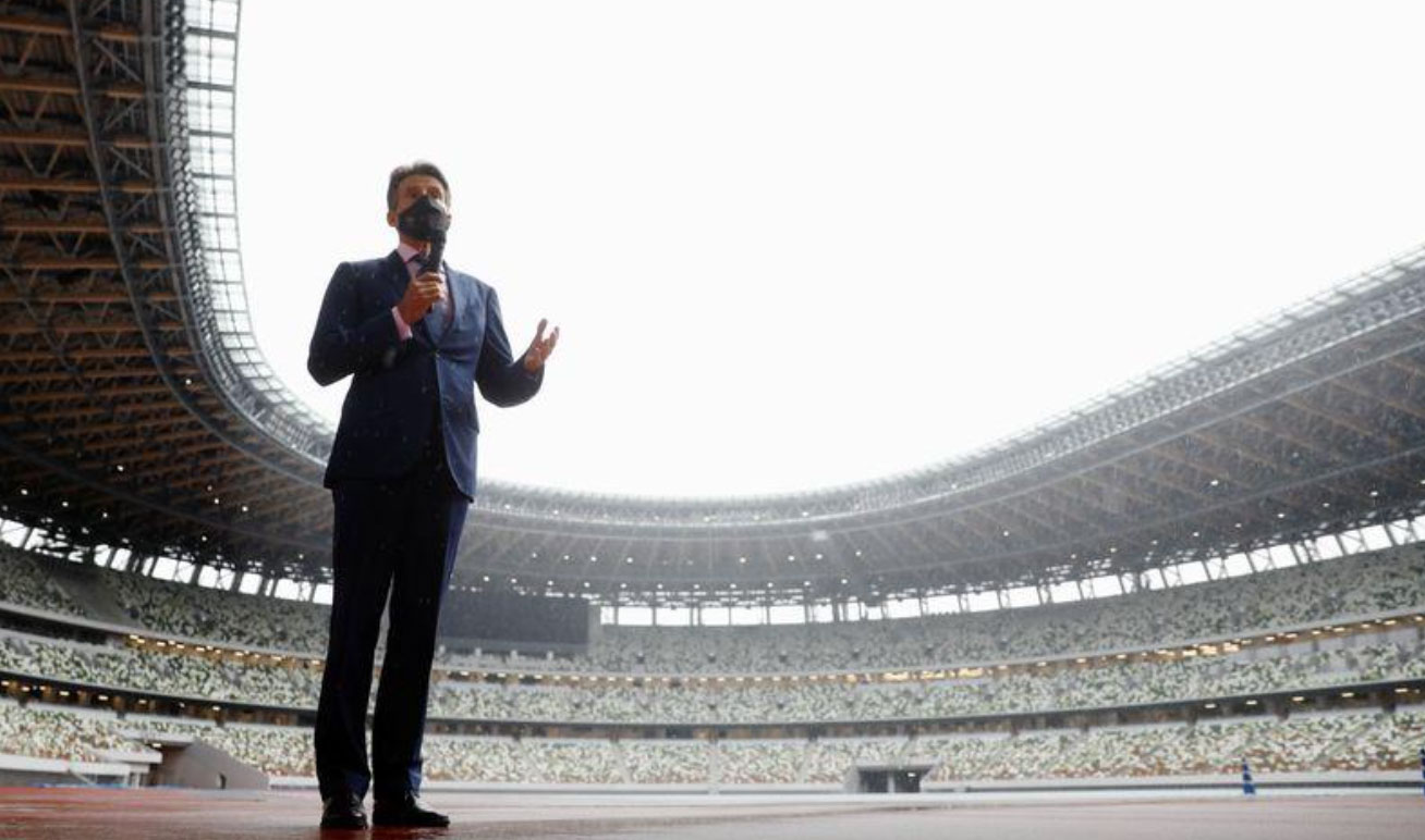 World Athletics President Sebastian Coe wearing a protective face mask speaks to media as he inspects at the National Stadium, the main stadium of Tokyo 2020 Olympics and Paralympics, amid the coronavirus disease (COVID-19) outbreak in Tokyo, Japan October 8, 2020. REUTERS/Issei Kato/Pool