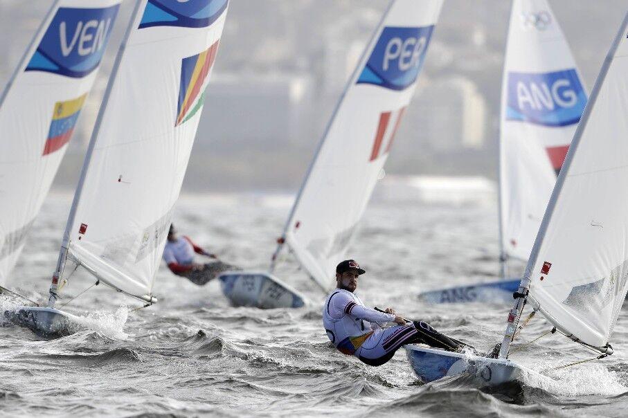 SMOOTH SAILING: T&T’s Andrew Lewis, right, competes during the Laser men’s event at the 2016 Summer Olympics in Rio de Janeiro, Brazil. —Photos: AP