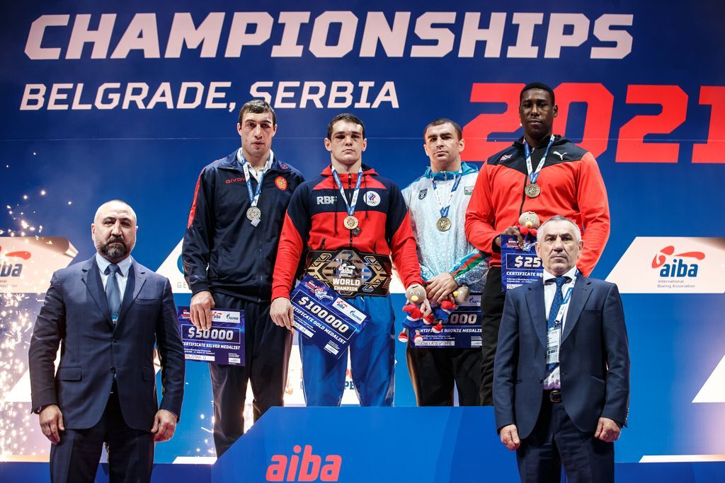 T&T’s boxer Nigel Paul, right, with his bronze medal and US$25,000 after he lost 4-1 to Mark Petrovskii, second from left, of Russia in their semi-final match. Petrovskiii won the title after defeating Armenia’s Davit Chaloyan, who had to settle for the silver medal and US$50,000 in the Men’s Super heavyweight (92+ Kg) at the AIBA World Boxing Championships in Serbia on Friday. Petrovskii, the gold medalist earned US$100,000, while the other bronze medallist was Mahammad Abdullayev, third from right, of Azerbaijan. He also collected US$25,000. Paul, 27, is the first boxer from the T&T to win a medal at the AIBA World Championships. It’s the only medal won by a boxer from the Caribbean at the tournament. Picture courtesy AIBA