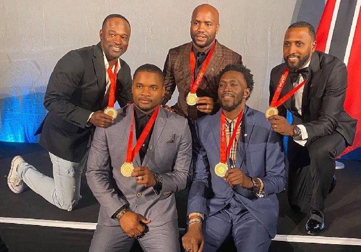 JUST REWARD: The 2008 Olympic Games men’s 4x100-metre champions pose with their gold medals at the Medal Reallocation Ceremony in Lausanne, Switzerland, yesterday. Back row, from left, Aaron Armstrong, Emmanuel Callender and Richard “Torpedo” Thompson. Front row, from left, Keston Bledman and Marc Burns. (Source: Trinidad Express Newspapers)