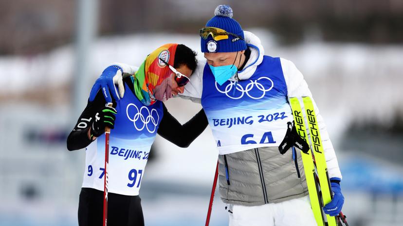 Carlos Andres Quintana was embraced by gold medallist Iivo Niskanen of Finland after their 15km cross-country skiing event. Credit: Clive Rose/Getty Images