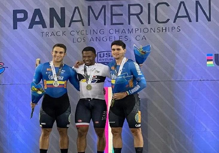 SPRINT KING: Trinidad and Tobago’s Nicholas Paul, centre, shows off his sprint gold medal on the penultimate day of the Pan Am Elite Track Cycling Championships, in Los Angeles, California, USA, on Saturday night. Paul is flanked on the podium by Colombians Christian Ortega, left, and Santiago Morales, who copped the silver and bronze medals, respectively. (Image obtained at trinidadexpress.com)